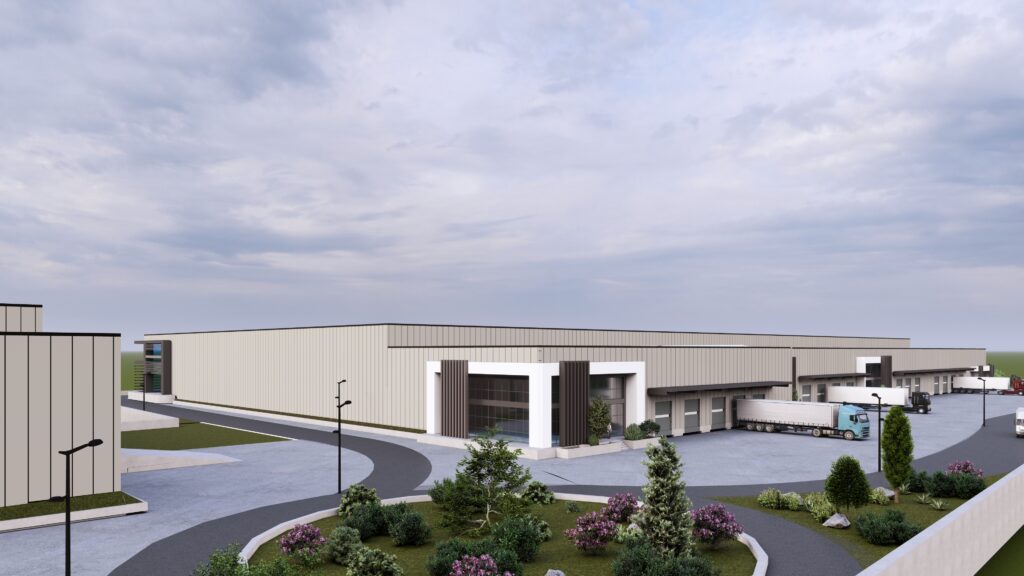 Συγκρότημα αποθηκών logistics στην Αττική με φορτηγά και πράσινο περιβάλλον.